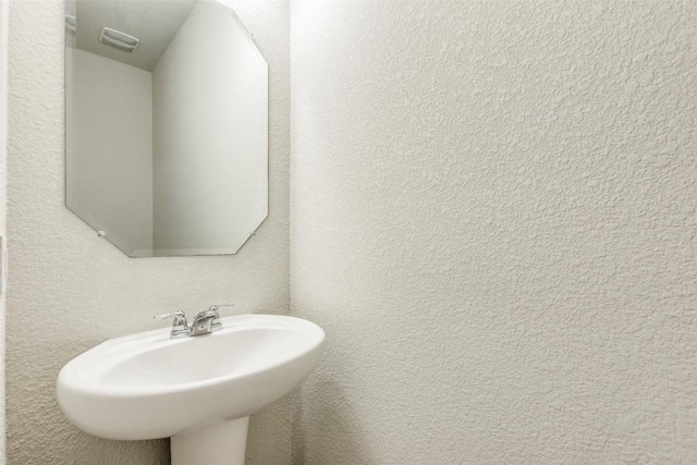 11905 Reindeer Dr, Austin, TX 78754 - bathroom with a sink and a textured wall