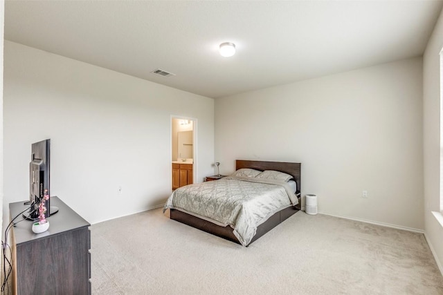 11905 Reindeer Dr, Austin, TX 78754 - bedroom with light carpet and ensuite bathroom