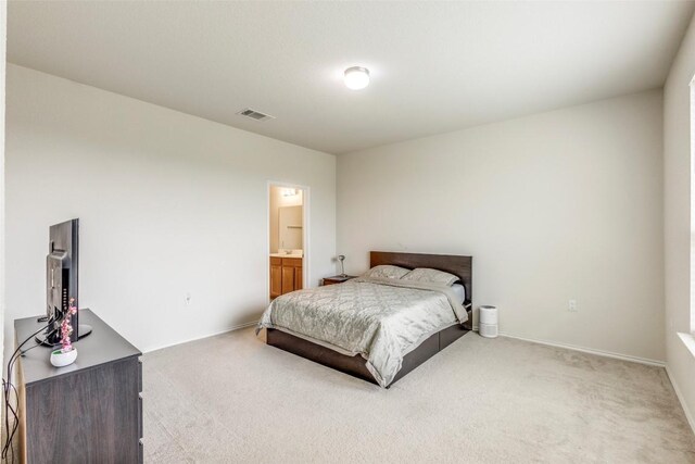 11905 Reindeer Dr, Austin, TX 78754 - bedroom featuring light colored carpet and ensuite bathroom