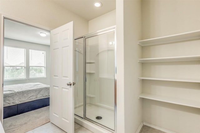 11905 Reindeer Dr, Austin, TX 78754 - full bathroom with a stall shower, tile patterned floors, connected bathroom, and baseboards