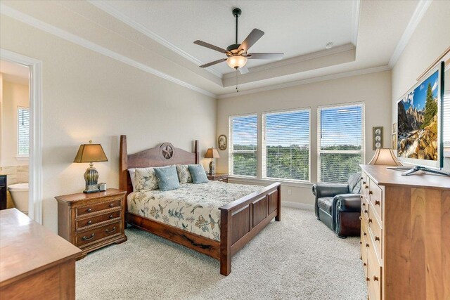 19440 Serenity Ln, Lago Vista, TX 78645 - bedroom with crown molding, a raised ceiling, light colored carpet, a ceiling fan, and baseboards