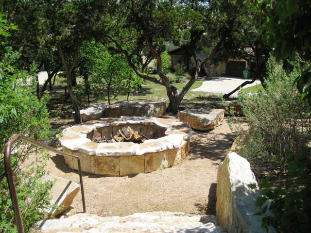 view of yard with a fire pit