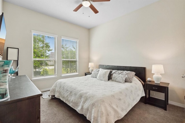 bedroom with baseboards, carpet floors, and a ceiling fan
