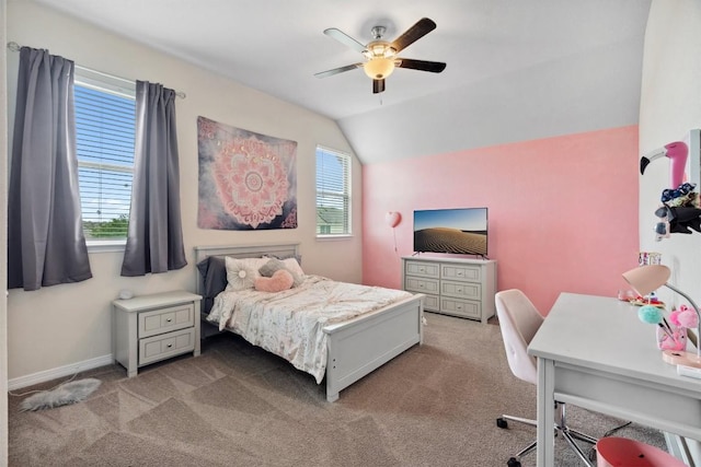 carpeted bedroom featuring a desk, lofted ceiling, a ceiling fan, and baseboards