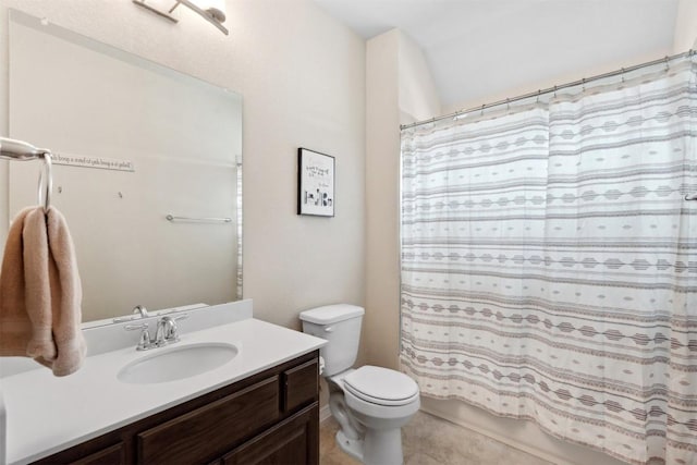 full bath featuring toilet, vanity, shower / bath combo, and tile patterned flooring