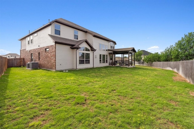 rear view of house featuring central air condition unit, brick siding, and a patio area