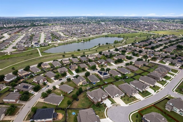 aerial overview of property's location with nearby suburban area and a large body of water