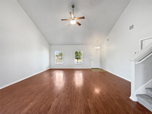 324 Pack Horse Dr, Bastrop, TX 78602 - unfurnished living room featuring high vaulted ceiling, a ceiling fan, stairs, a chandelier, and wood finished floors