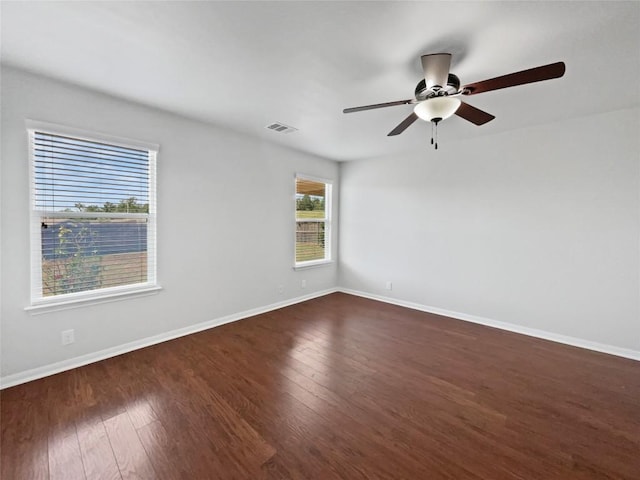 324 Pack Horse Dr, Bastrop, TX 78602 - spare room with dark wood finished floors and a ceiling fan