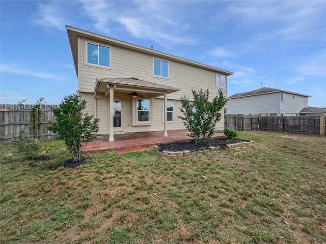 324 Pack Horse Dr, Bastrop, TX 78602 - rear view of house featuring a patio area, a ceiling fan, and a fenced backyard