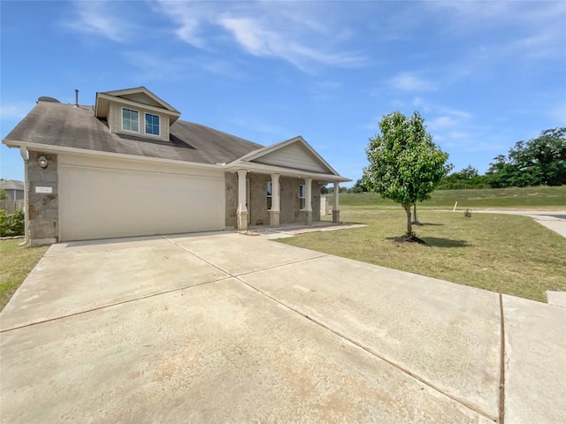 324 Pack Horse Dr, Bastrop, TX 78602 - view of front facade featuring a front yard, covered porch, driveway, and a garage