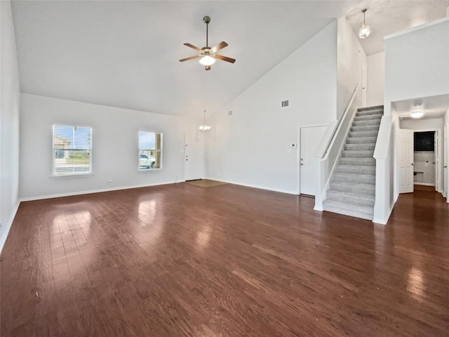 324 Pack Horse Dr, Bastrop, TX 78602 - unfurnished living room with stairway, a ceiling fan, high vaulted ceiling, and wood finished floors