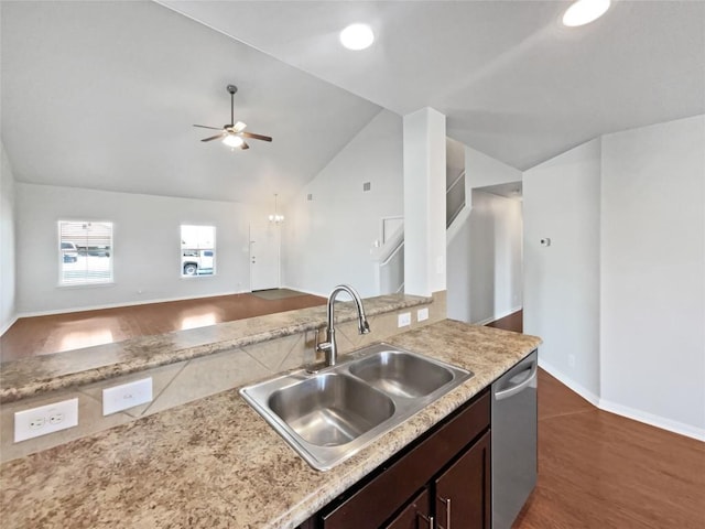324 Pack Horse Dr, Bastrop, TX 78602 - kitchen with stainless steel dishwasher, vaulted ceiling, light countertops, dark brown cabinets, and ceiling fan