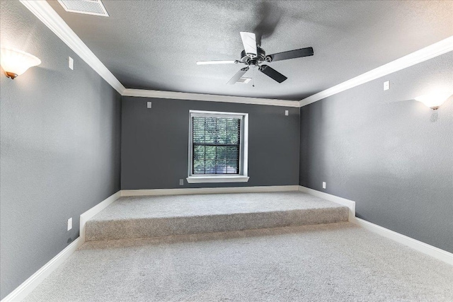 468 Monahans Dr, Georgetown, TX 78628 - spare room with crown molding, carpet flooring, a ceiling fan, a textured ceiling, and baseboards