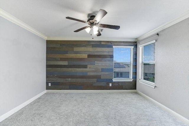 468 Monahans Dr, Georgetown, TX 78628 - carpeted spare room featuring ornamental molding, a ceiling fan, and wood walls