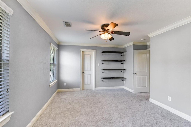 468 Monahans Dr, Georgetown, TX 78628 - unfurnished bedroom featuring carpet, ornamental molding, and ceiling fan