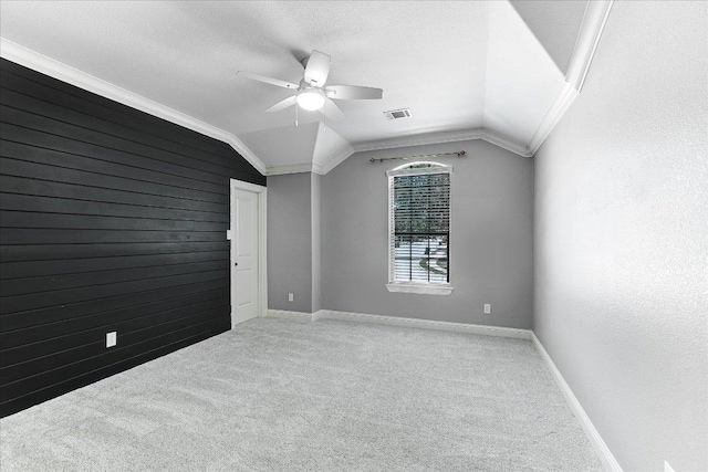468 Monahans Dr, Georgetown, TX 78628 - carpeted spare room with ceiling fan, vaulted ceiling, and wooden walls