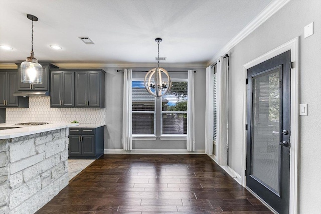 468 Monahans Dr, Georgetown, TX 78628 - unfurnished dining area with a chandelier, ornamental molding, and hardwood / wood-style floors