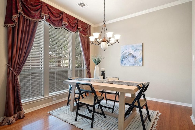 1502 Azalea Dr, Cedar Park, TX 78613 - dining room with baseboards, a chandelier, wood finished floors, crown molding, and an office area