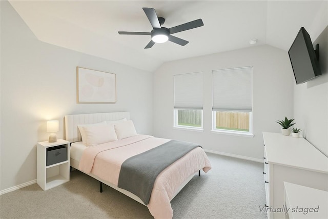 2024 Cantonata Dr, Leander, TX 78641 - bedroom featuring light carpet, vaulted ceiling, and ceiling fan