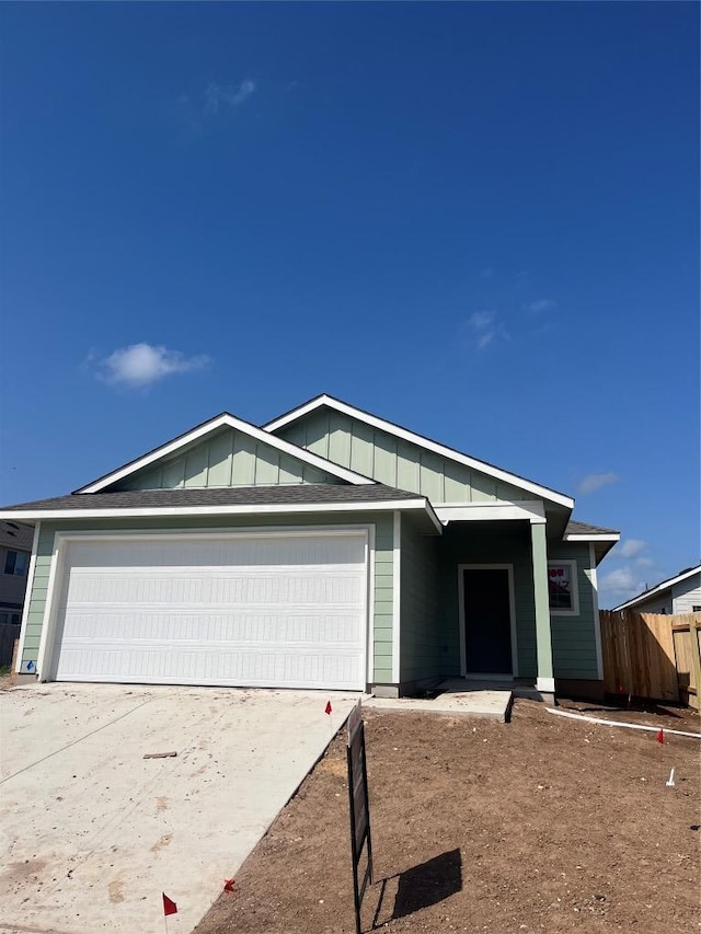 347 Witchhazel Way, San Marcos, TX 78666 - single story home with a garage, fence, driveway, and board and batten siding