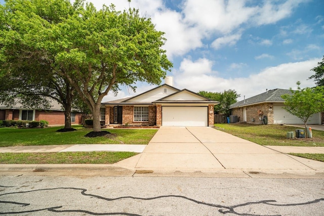 1420 Marsh Harbour Dr, Round Rock, TX 78664 - ranch-style home with brick siding, an attached garage, driveway, and a front lawn