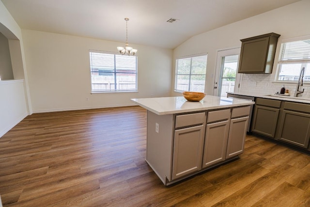 1420 Marsh Harbour Dr, Round Rock, TX 78664 - kitchen featuring gray cabinetry, a sink, vaulted ceiling, and dark wood-style flooring