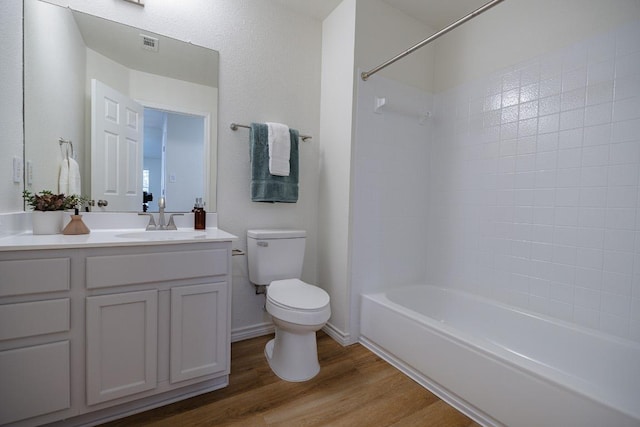 1420 Marsh Harbour Dr, Round Rock, TX 78664 - bathroom featuring toilet, wood finished floors, bathing tub / shower combination, and vanity