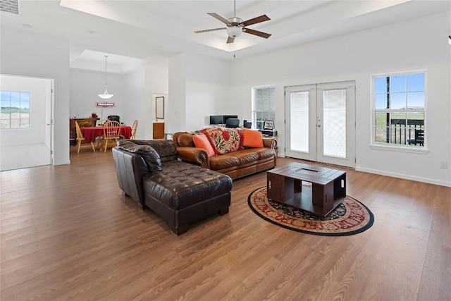 3424 S Old Bastrop Hwy, San Marcos, TX 78666 - living area with wood finished floors, healthy amount of natural light, ceiling fan, a towering ceiling, and french doors