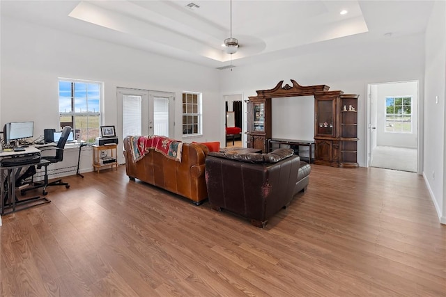3424 S Old Bastrop Hwy, San Marcos, TX 78666 - living room featuring french doors, a raised ceiling, an office area, wood finished floors, and a ceiling fan