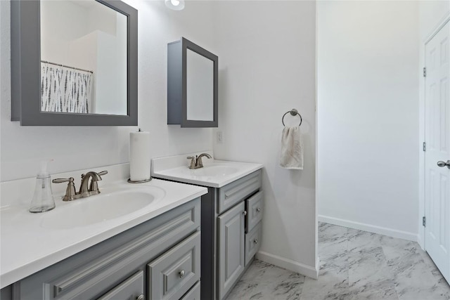 3424 S Old Bastrop Hwy, San Marcos, TX 78666 - full bath with marble finish flooring, baseboards, and two vanities