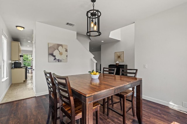 21016 Penny Royal Dr, Pflugerville, TX 78660 - dining room with baseboards, wood finished floors, recessed lighting, and stairs
