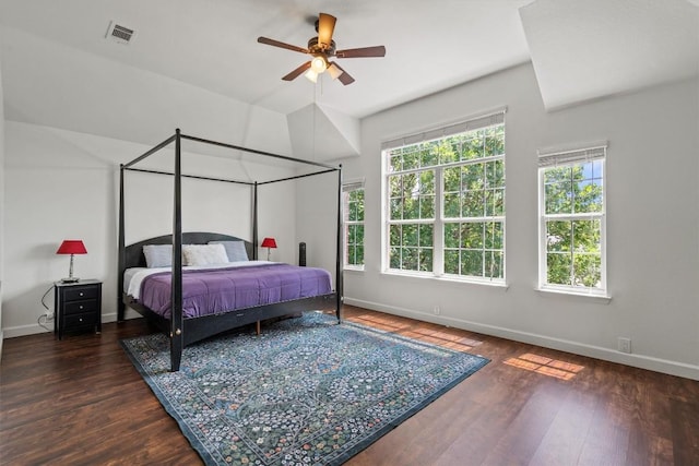 bedroom with baseboards, wood finished floors, and a ceiling fan
