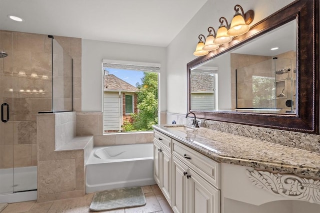 21016 Penny Royal Dr, Pflugerville, TX 78660 - bathroom featuring vanity, a bath, a shower stall, and tile patterned floors