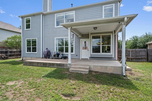 21016 Penny Royal Dr, Pflugerville, TX 78660 - back of property featuring a chimney and a patio area
