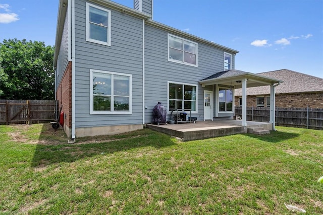 21016 Penny Royal Dr, Pflugerville, TX 78660 - rear view of property featuring a chimney and a patio area