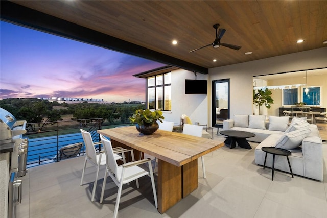 view of patio / terrace with an outdoor living space, a ceiling fan, and outdoor dining area