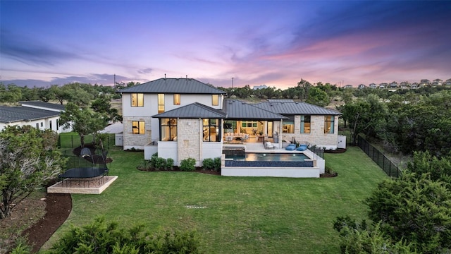 6404 Madrone Tree Ln, Austin, TX 78738 - back of property with stone siding, a standing seam roof, and metal roof