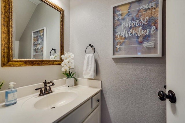 7605 Hawkeye Dr, Austin, TX 78749 - bathroom featuring vanity and a textured wall
