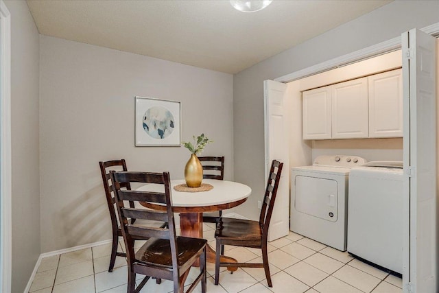7605 Hawkeye Dr, Austin, TX 78749 - dining room featuring washer and clothes dryer, light tile patterned floors, and baseboards