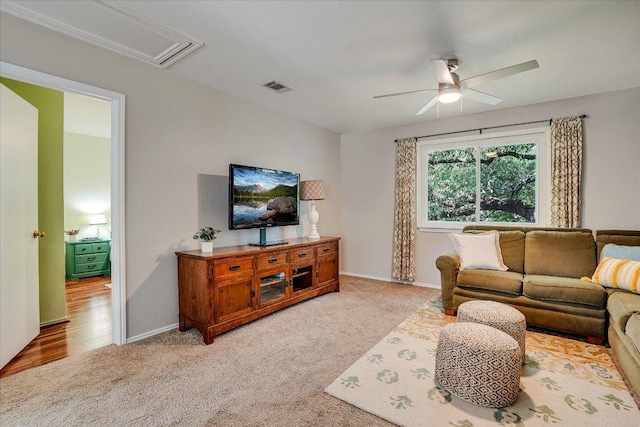 7605 Hawkeye Dr, Austin, TX 78749 - living area with a ceiling fan, light carpet, attic access, and baseboards