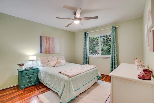 7605 Hawkeye Dr, Austin, TX 78749 - bedroom with wood finished floors and a ceiling fan