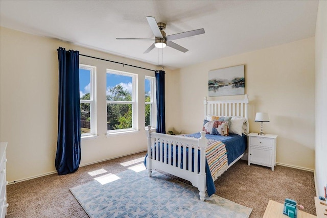 7605 Hawkeye Dr, Austin, TX 78749 - bedroom featuring light carpet, a ceiling fan, and baseboards