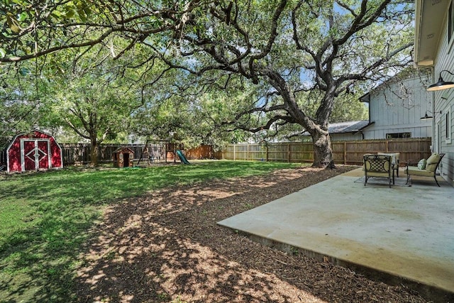 7605 Hawkeye Dr, Austin, TX 78749 - view of yard with a patio, a storage shed, a playground, and an outdoor structure