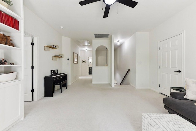 340 Palo Alto Way, Austin, TX 78732 - sitting room featuring attic access, an upstairs landing, carpet floors, a ceiling fan, and baseboards