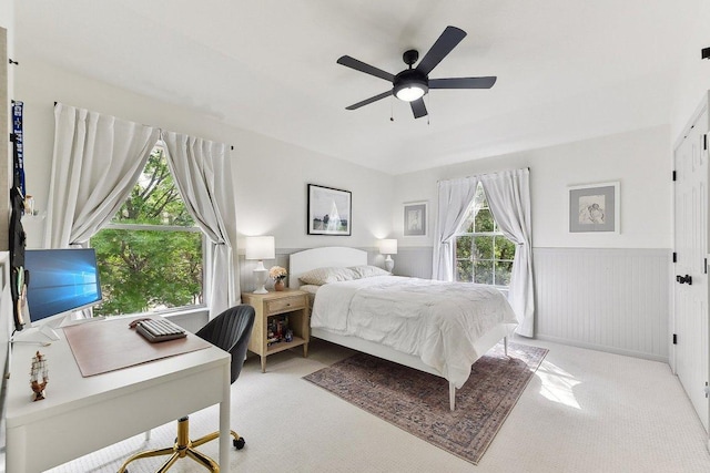 340 Palo Alto Way, Austin, TX 78732 - bedroom with light carpet, a wainscoted wall, an office area, and ceiling fan