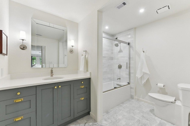 340 Palo Alto Way, Austin, TX 78732 - full bathroom featuring marble look tile flooring, toilet, vanity, shower / bath combination with glass door, and baseboards