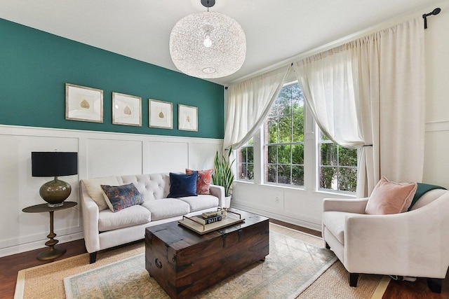 340 Palo Alto Way, Austin, TX 78732 - living room with wood finished floors, a wainscoted wall, and a decorative wall
