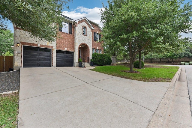 340 Palo Alto Way, Austin, TX 78732 - view of front of house with concrete driveway, stone siding, an attached garage, and brick siding