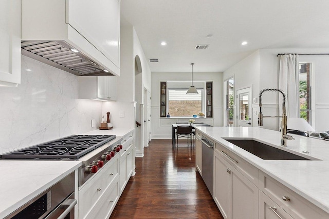 340 Palo Alto Way, Austin, TX 78732 - kitchen featuring a sink, appliances with stainless steel finishes, recessed lighting, backsplash, and dark wood-style flooring